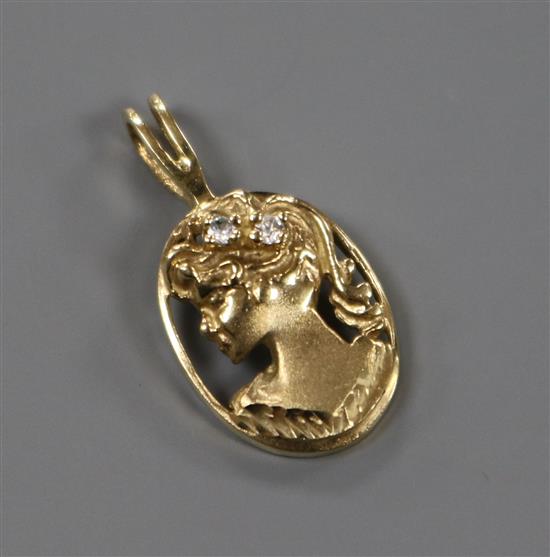 A modern yellow metal and gem set pierced oval pendant, modelled as the bust of a lady to dexter, 23mm inc. bale.